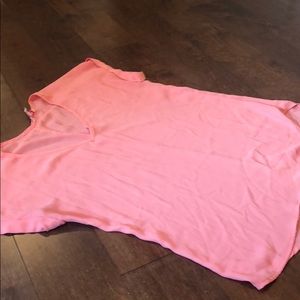a light orangey pink v neck dress up shirt